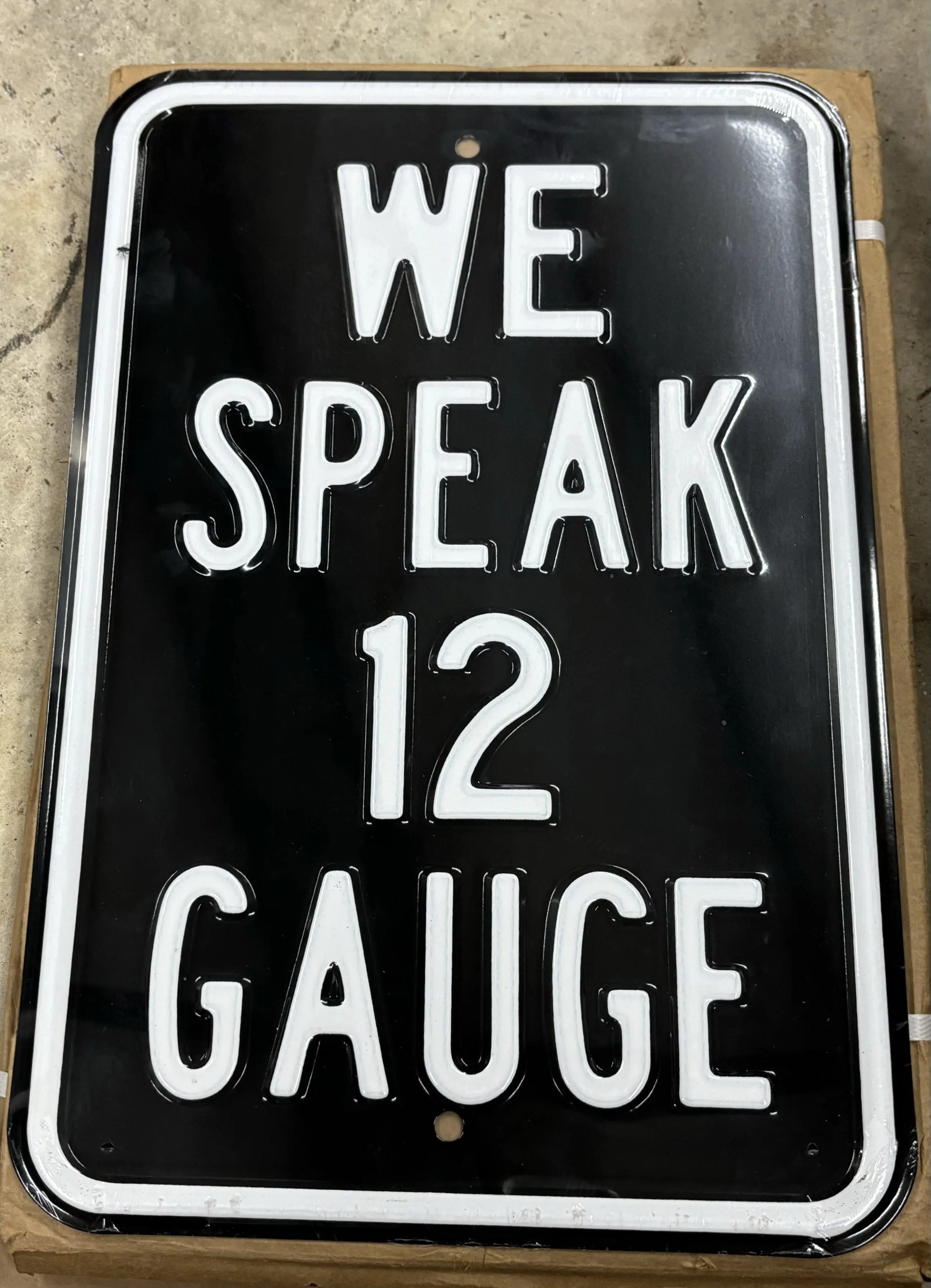 We Speak 12 Gauge - Parking Signs Metal Sign